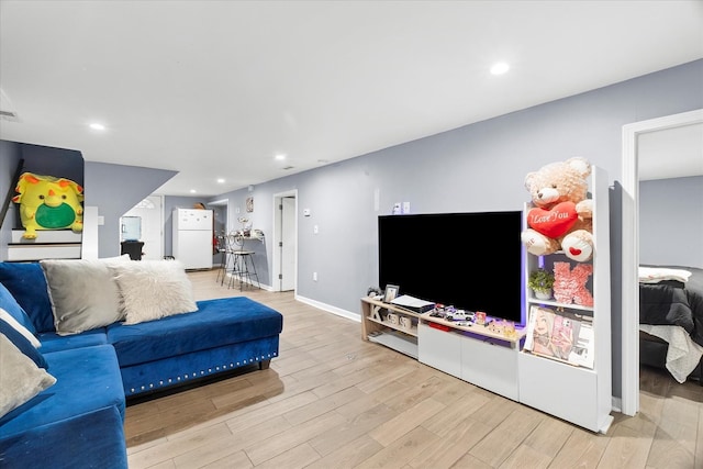 11030 S Ave L, Chicago, IL 60617 - living area with light wood-style floors and recessed lighting
