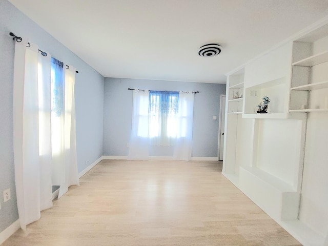 1357 Morgan St, Joliet, IL 60436 - unfurnished room with baseboards and light wood finished floors