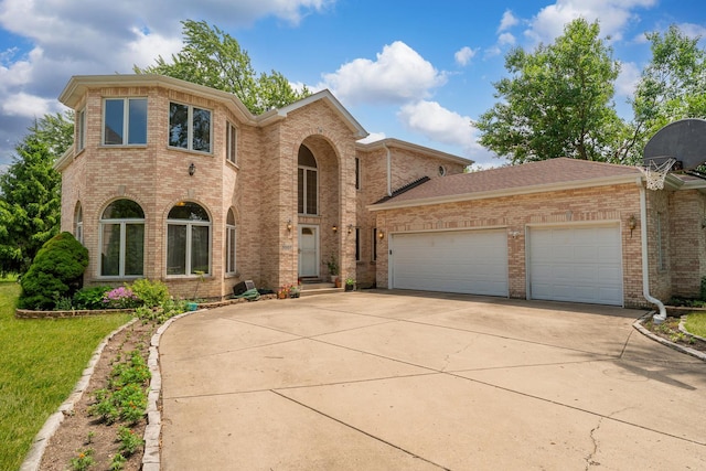 1007 Wildwood Ln, Mount Prospect, IL 60056 - traditional-style house with driveway, brick siding, and an attached garage