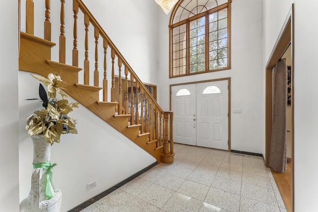 1007 Wildwood Ln, Mount Prospect, IL 60056 - entrance foyer with a towering ceiling, stairway, and plenty of natural light