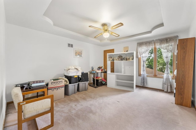 1007 Wildwood Ln, Mount Prospect, IL 60056 - living area with a raised ceiling, ceiling fan, and carpet