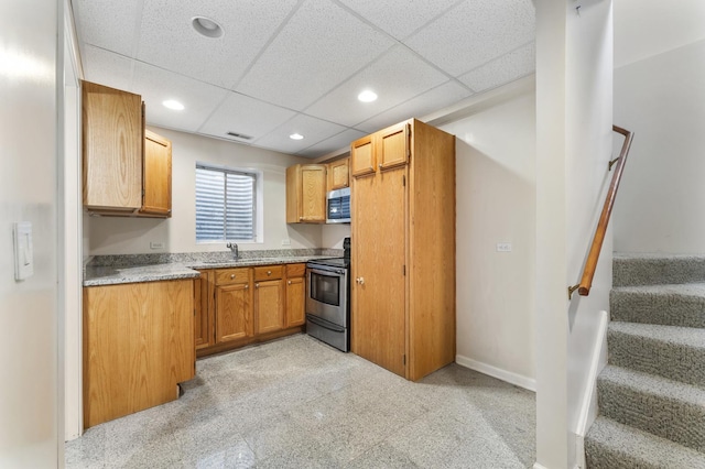 1007 Wildwood Ln, Mount Prospect, IL 60056 - kitchen with stainless steel appliances, recessed lighting, a paneled ceiling, and brown cabinetry