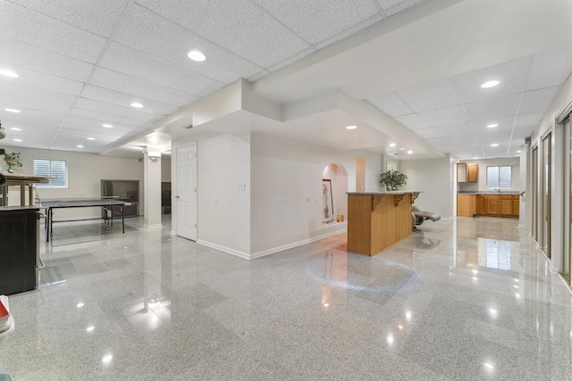 1007 Wildwood Ln, Mount Prospect, IL 60056 - bar area featuring a paneled ceiling, granite tiled floors, arched walkways, and recessed lighting
