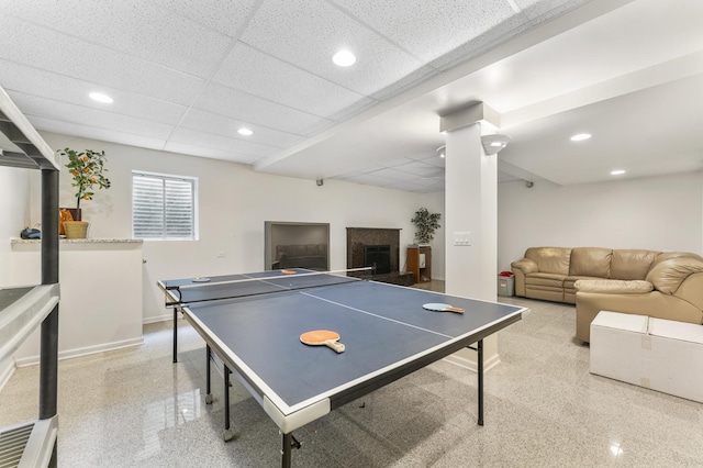 1007 Wildwood Ln, Mount Prospect, IL 60056 - game room featuring recessed lighting, a fireplace with raised hearth, speckle patterned floor, and decorative columns