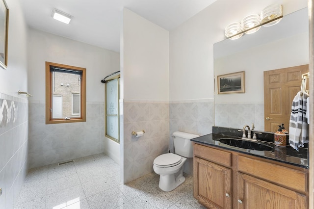 1007 Wildwood Ln, Mount Prospect, IL 60056 - bathroom with tile walls, vanity, a wainscoted wall, and shower / bath combination