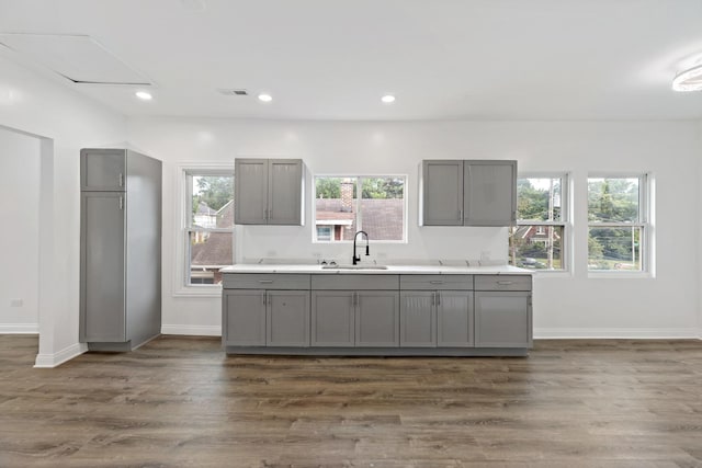 1668 Buena Vista Ave, Chicago Heights, IL 60411 - kitchen with gray cabinetry, plenty of natural light, light countertops, and recessed lighting