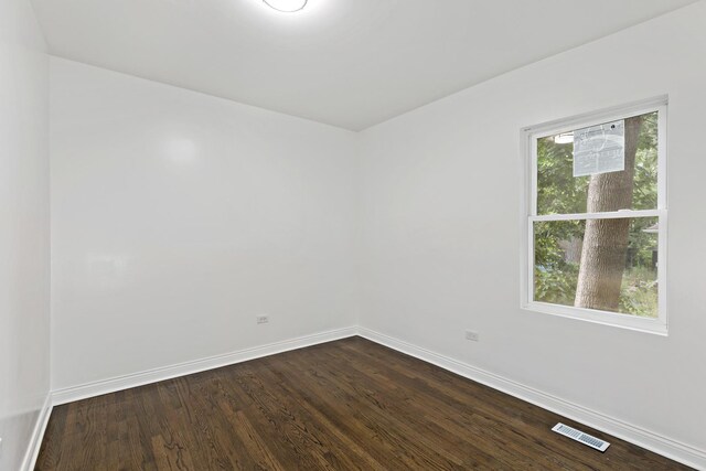 1668 Buena Vista Ave, Chicago Heights, IL 60411 - empty room with baseboards and dark wood-style flooring