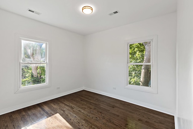 1668 Buena Vista Ave, Chicago Heights, IL 60411 - unfurnished room with baseboards and dark wood-style flooring