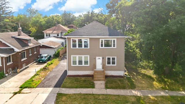 1668 Buena Vista Ave, Chicago Heights, IL 60411 - view of front facade with asphalt driveway and a front yard