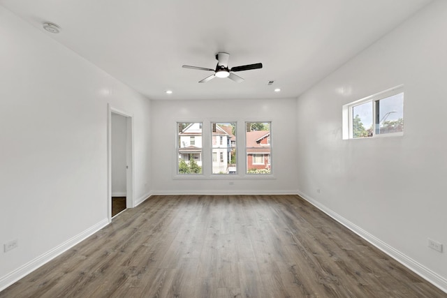 1668 Buena Vista Ave, Chicago Heights, IL 60411 - empty room with a smoke detector, healthy amount of natural light, dark wood-style flooring, ceiling fan, and recessed lighting