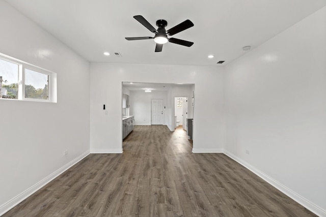 1668 Buena Vista Ave, Chicago Heights, IL 60411 - unfurnished living room with dark wood-type flooring, a ceiling fan, and recessed lighting