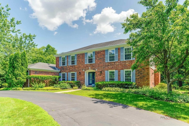 555 W Everett Rd, Lake Forest, IL 60045 - colonial home with brick siding and a front yard
