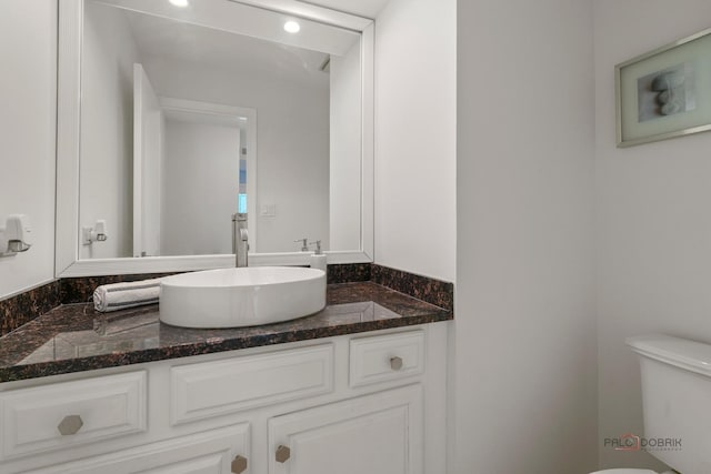 555 W Everett Rd, Lake Forest, IL 60045 - half bathroom featuring vanity and toilet