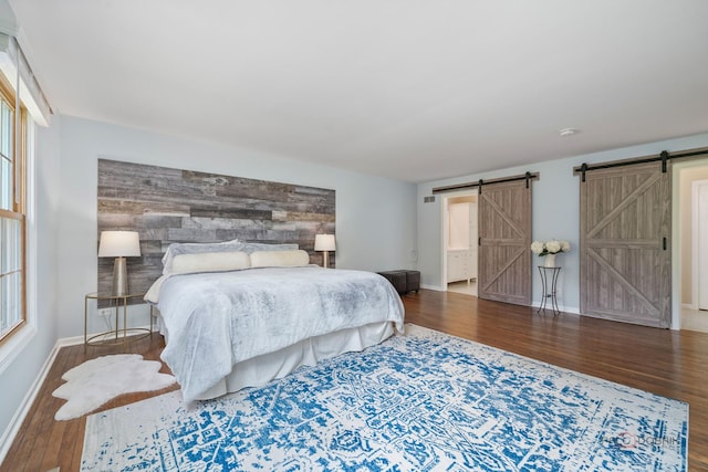 555 W Everett Rd, Lake Forest, IL 60045 - bedroom featuring a barn door and wood finished floors