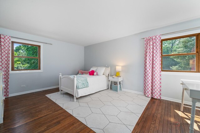 555 W Everett Rd, Lake Forest, IL 60045 - bedroom with hardwood / wood-style flooring and multiple windows
