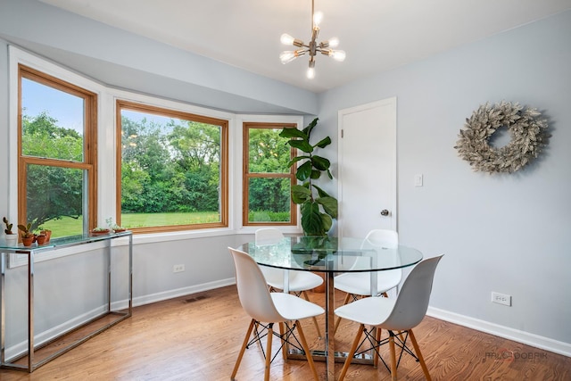 555 W Everett Rd, Lake Forest, IL 60045 - dining room featuring a chandelier and light wood-style floors