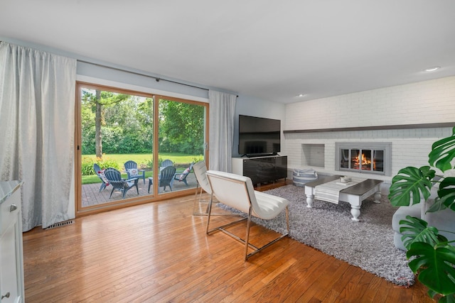 555 W Everett Rd, Lake Forest, IL 60045 - living room featuring a brick fireplace and hardwood / wood-style flooring