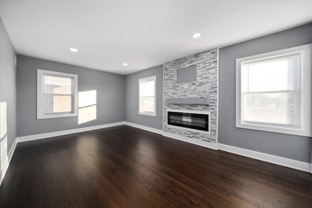 10806 S Vernon Ave, Chicago, IL 60628 - unfurnished living room featuring a fireplace, dark wood finished floors, and recessed lighting