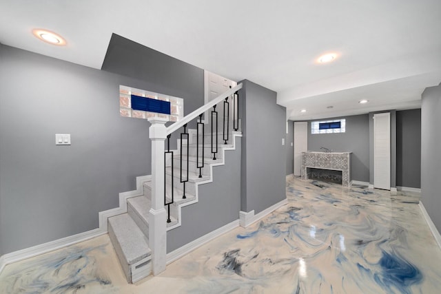 10806 S Vernon Ave, Chicago, IL 60628 - stairs featuring recessed lighting and a tiled fireplace