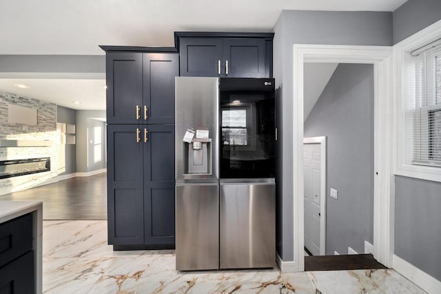 10806 S Vernon Ave, Chicago, IL 60628 - kitchen featuring stainless steel fridge with ice dispenser and light marble finish floors