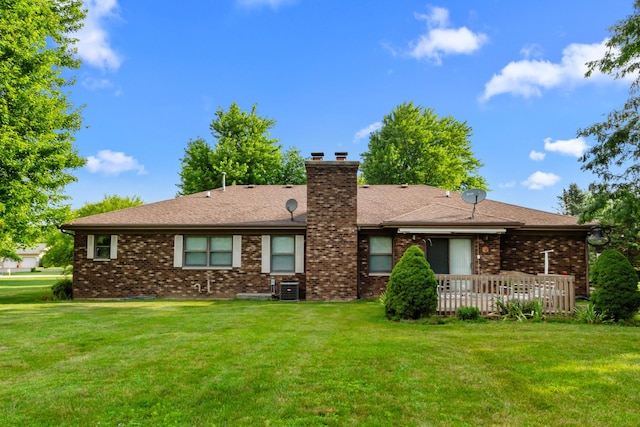 23201 Norma Ln, Harvard, IL 60033 - rear view of house with a lawn, brick siding, a chimney, a wooden deck, and roof with shingles