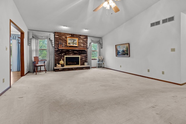 23201 Norma Ln, Harvard, IL 60033 - unfurnished living room featuring carpet floors, a fireplace, vaulted ceiling, and a ceiling fan