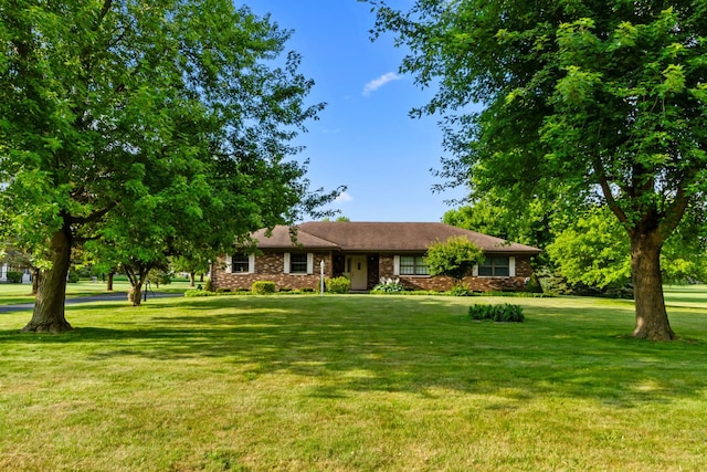 23201 Norma Ln, Harvard, IL 60033 - ranch-style house featuring a front lawn and brick siding