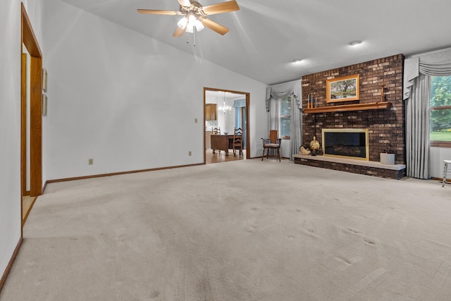 23201 Norma Ln, Harvard, IL 60033 - unfurnished living room featuring vaulted ceiling, carpet flooring, ceiling fan, and a brick fireplace