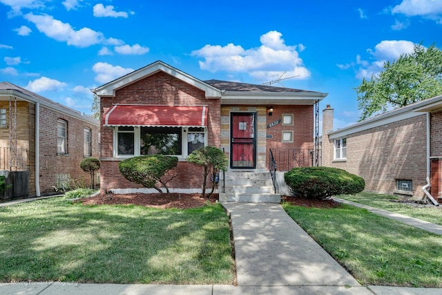 8822 S Paulina St, Chicago, IL 60620 - view of front of property with brick siding and a front yard