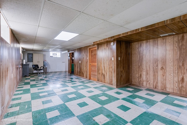 8822 S Paulina St, Chicago, IL 60620 - below grade area featuring tile patterned floors, wooden walls, and a paneled ceiling