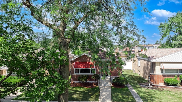 8822 S Paulina St, Chicago, IL 60620 - view of front of house featuring brick siding and a front lawn