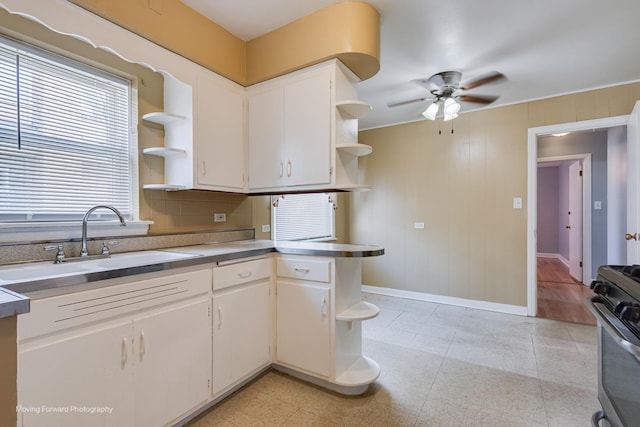 8822 S Paulina St, Chicago, IL 60620 - kitchen with open shelves, a ceiling fan, stove, and white cabinets