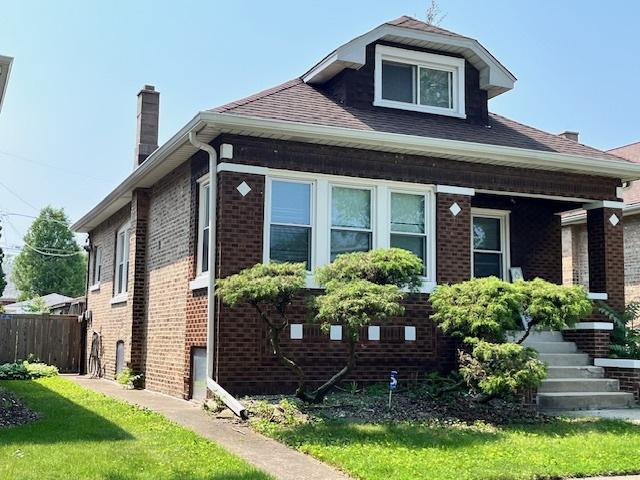2722 Euclid Ave, Berwyn, IL 60402 - view of side of property with a chimney, brick siding, and a shingled roof