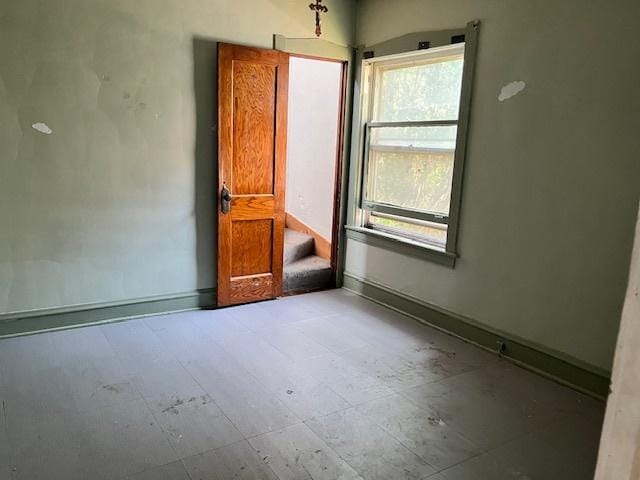 2722 Euclid Ave, Berwyn, IL 60402 - spare room with baseboards and stairway