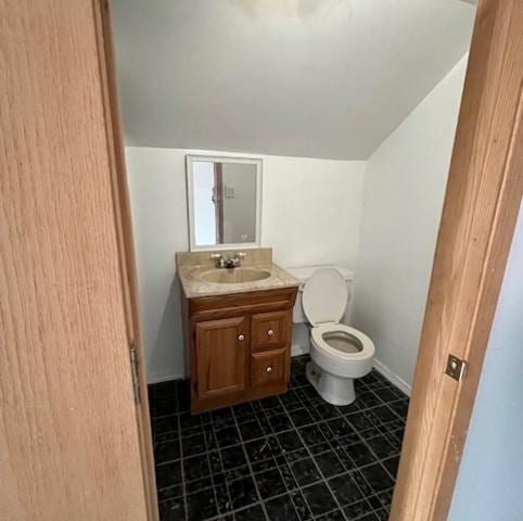 2722 Euclid Ave, Berwyn, IL 60402 - bathroom featuring vanity, vaulted ceiling, and tile patterned floors