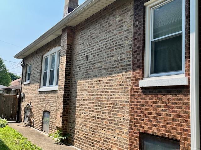 2722 Euclid Ave, Berwyn, IL 60402 - view of property exterior with brick siding and a chimney