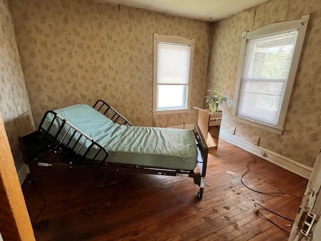 2722 Euclid Ave, Berwyn, IL 60402 - bedroom with hardwood / wood-style flooring and wallpapered walls