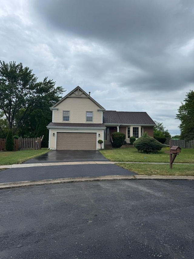 2404 Kenmore Ct, Schaumburg, IL 60193 - view of front facade with an attached garage and asphalt driveway