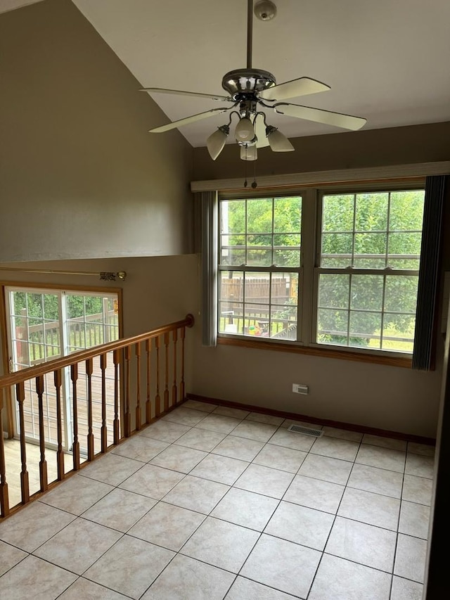 2404 Kenmore Ct, Schaumburg, IL 60193 - unfurnished room with ceiling fan, light tile patterned floors, and lofted ceiling