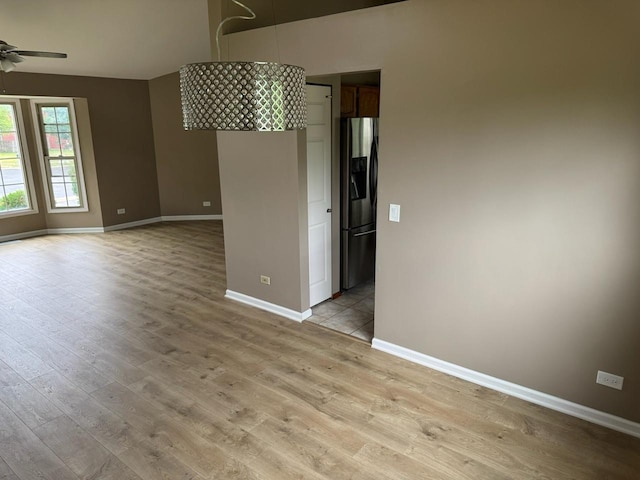 2404 Kenmore Ct, Schaumburg, IL 60193 - spare room with ceiling fan and light wood-style floors