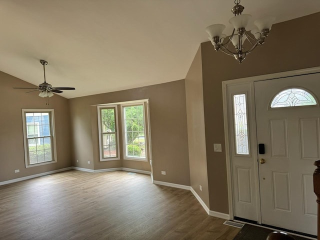2404 Kenmore Ct, Schaumburg, IL 60193 - entryway featuring vaulted ceiling, wood finished floors, a chandelier, and ceiling fan