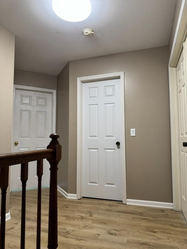 2404 Kenmore Ct, Schaumburg, IL 60193 - hall with an upstairs landing and light wood finished floors