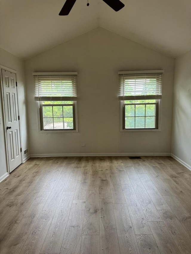 2404 Kenmore Ct, Schaumburg, IL 60193 - spare room featuring ceiling fan, hardwood / wood-style floors, and vaulted ceiling