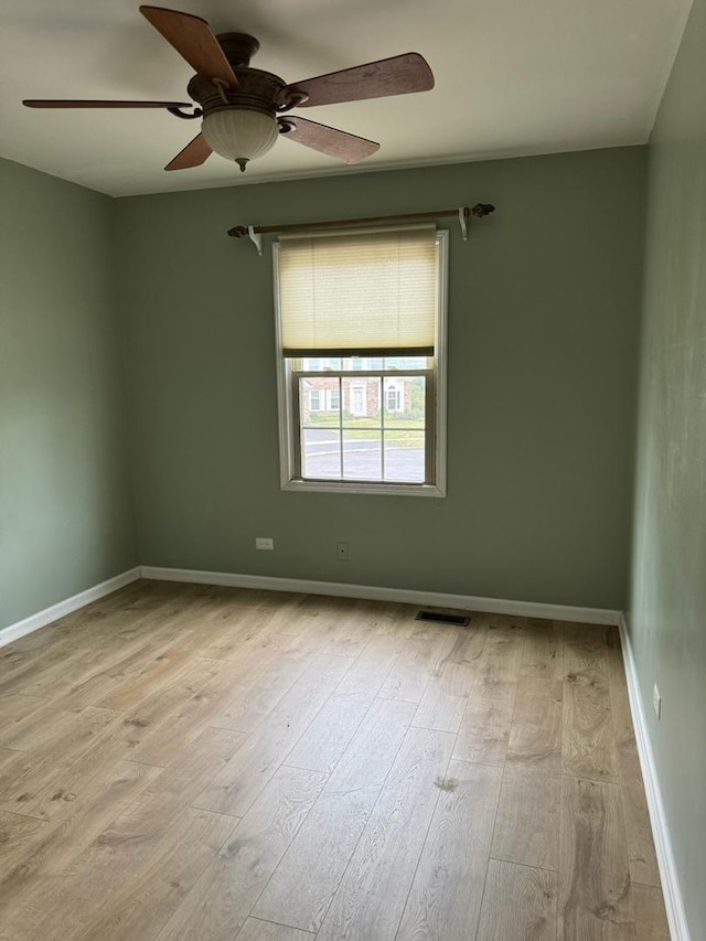2404 Kenmore Ct, Schaumburg, IL 60193 - spare room featuring wood finished floors and a ceiling fan