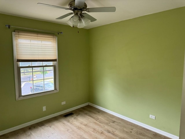 2404 Kenmore Ct, Schaumburg, IL 60193 - spare room featuring light wood-type flooring and a ceiling fan