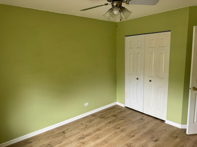 2404 Kenmore Ct, Schaumburg, IL 60193 - unfurnished bedroom featuring light wood-style floors, a closet, and ceiling fan