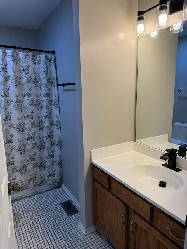 2404 Kenmore Ct, Schaumburg, IL 60193 - bathroom with vanity, tile patterned flooring, and curtained shower