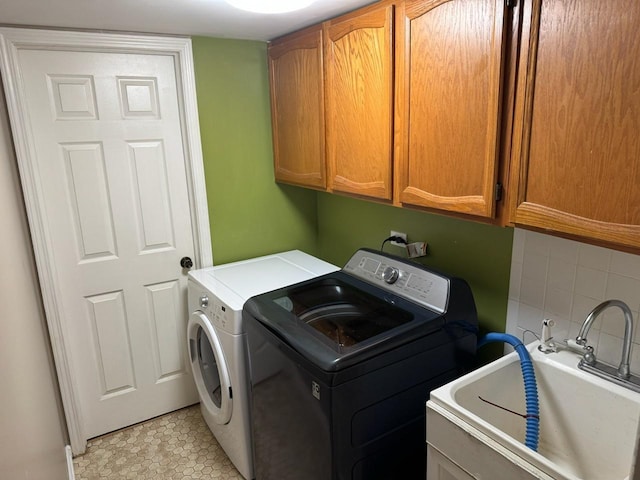 2404 Kenmore Ct, Schaumburg, IL 60193 - laundry area featuring cabinet space and washing machine and dryer