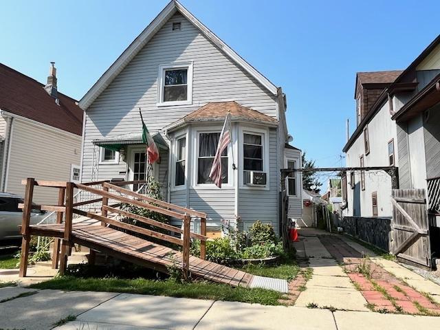 4160 W Eddy St, Chicago, IL 60641 - view of front facade with a gate