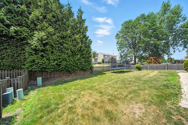 2942 Heather Ln, Montgomery, IL 60538 - fenced backyard featuring a trampoline